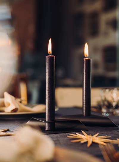 Illustrated is a candle on a table with a napkin and napkin, with the SQUARE CANDLE (Matrix - Parent).