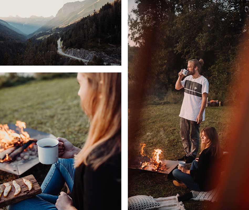 a couple sitting around a campfire in the mountains.