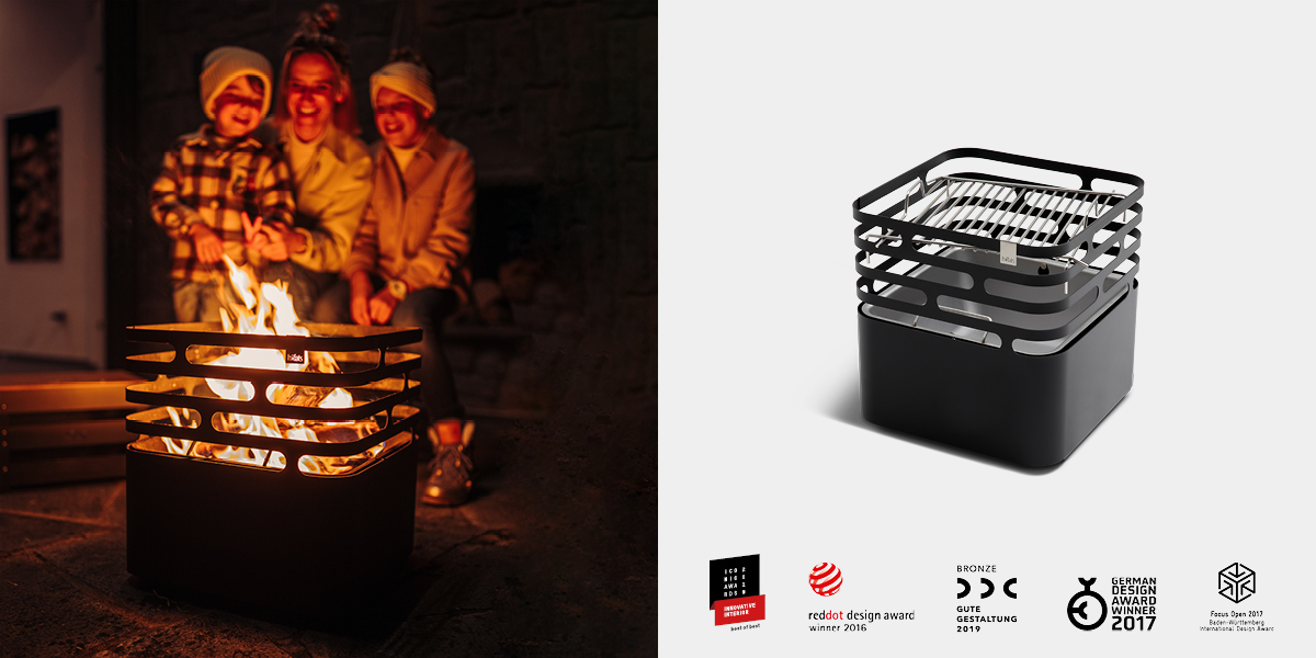 An inviting scene with a fire pit with a person in the background, highlighted by the presence of the Hofats Cube