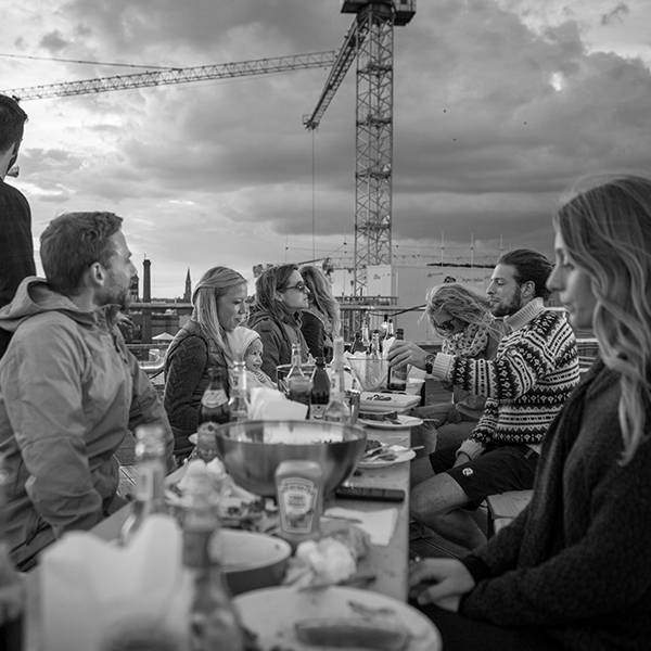 a group of people sitting at a table.