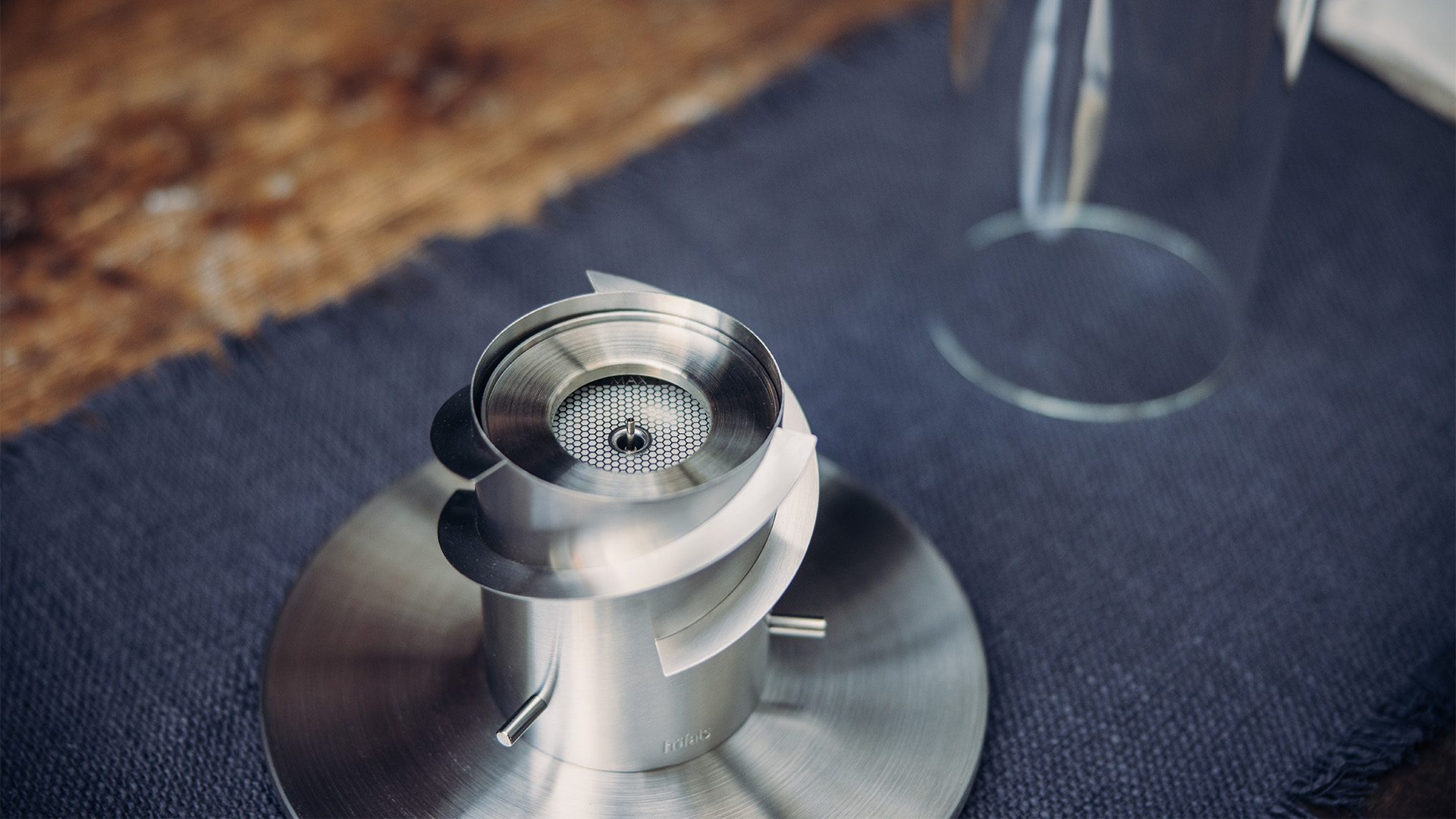 A closeup of the BioBurner inside a SPIN Tablefire, Spin Eco Ring complements the moment with its thoughtful design.