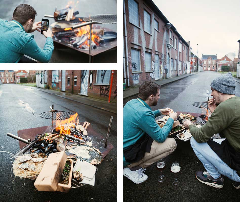 An image showing a man sitting on the ground next to a fire, with the BBQ Starter.