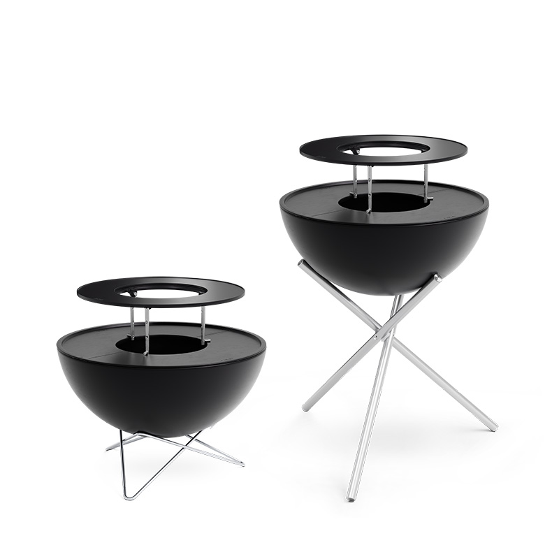 BOWL 57 Warming Ring An image showing two black and silver metal fire pits on a white background, with the BOWL 57 Warming Ring.