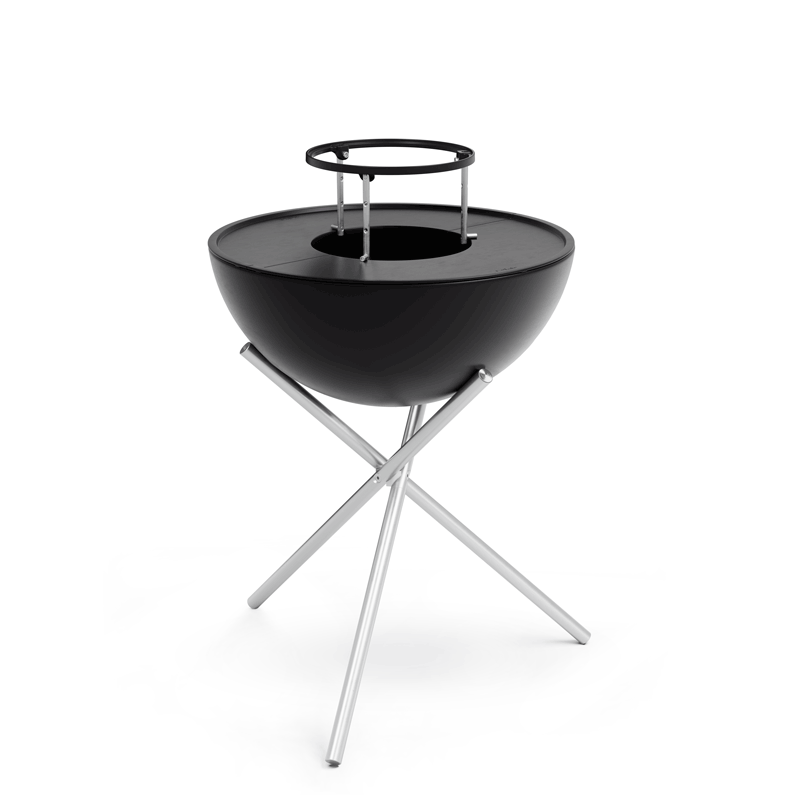 The photo presents a black barbecue grill with a metal stand, with the BOWL 70 Warming Ring.
