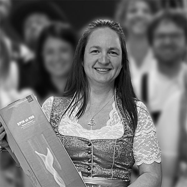 a woman holding a box of food