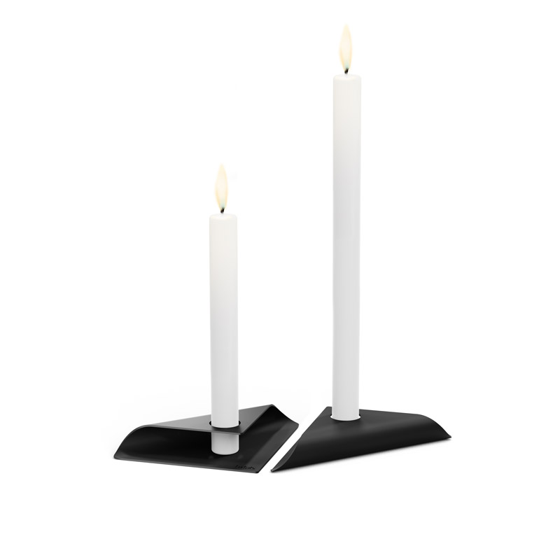 The photo presents two white candles on a black stand, with the SQUARE CANDLE Candleholder black.