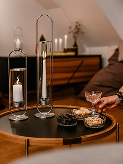 a woman sitting on a couch with a glass of wine.