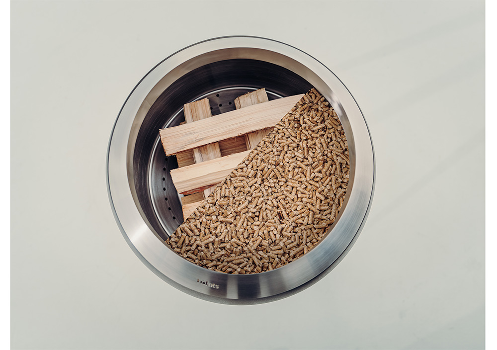 a bowl filled with wood chips and a wooden block.