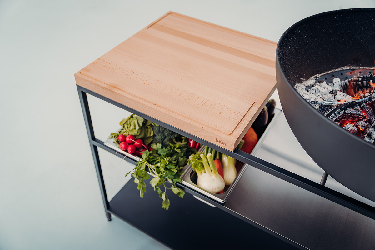 a large wooden cutting board. the 00614 Fire Kitchen Worktop