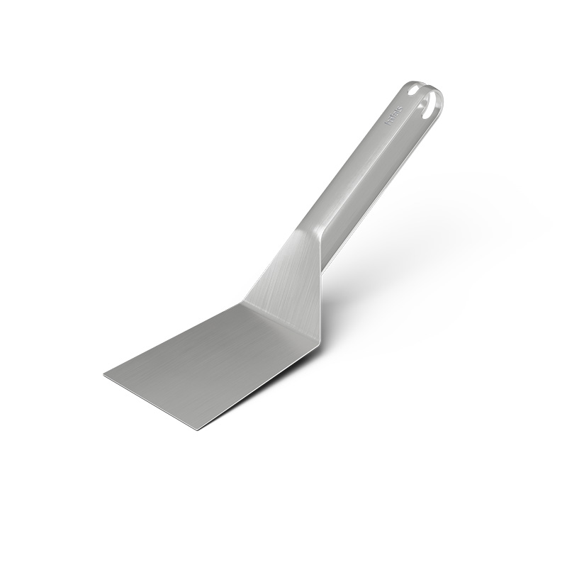 An image showing a metal spat with a handle on a white background