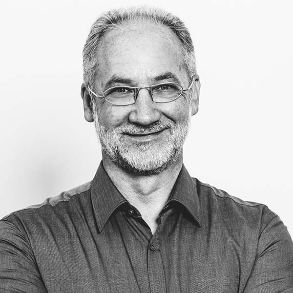 a man with glasses and a beard.