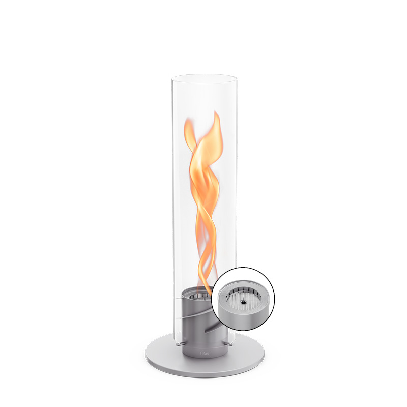 An inviting scene with a glass cylinder with a flame inside, highlighted by the presence of the 00697 Spin 1200 Tablefire grey