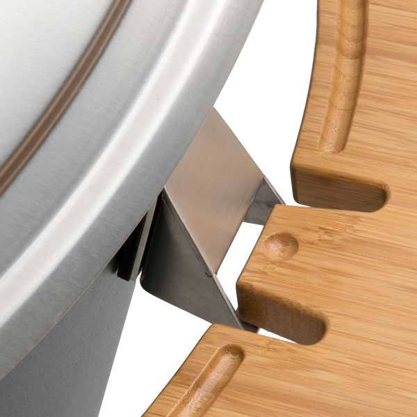 The photo presents a close up of a knife and a cutting board, with the CONE Board Support.