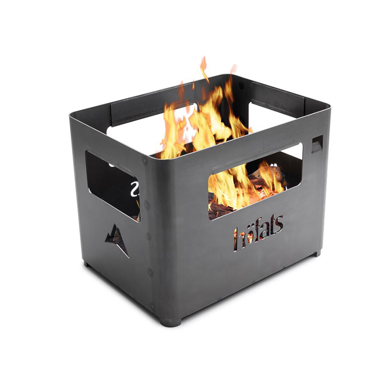 BEER BOX Fire Basket The Beer Box Firebasket integrates seamlessly into the setting, where a fire pit with flames burning in it