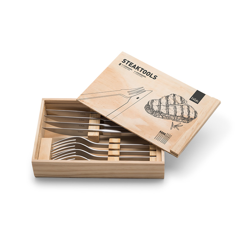 Steaktools A wooden box with a set of cutlers in it, with the Steaktools Tools adding a functional and elegant touch to the scene.