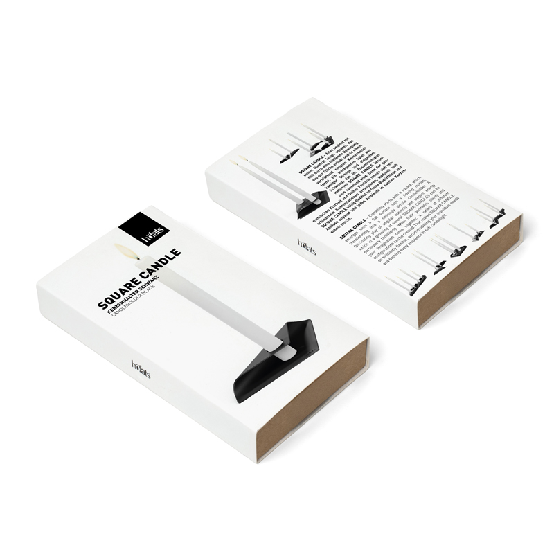 SQUARE CANDLE Candleholder black An inviting scene highlights the Square Candle Candleholder Packaging, blending effortlessly into its surroundings.