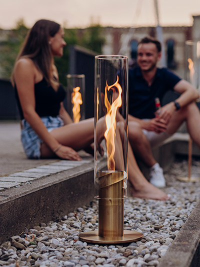 a couple sitting on a bench.