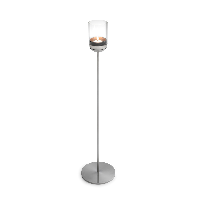GRAVITY CANDLE Pole Illustrated is a candle holder with a glass on top, with the GRAVITY CANDLE Base.