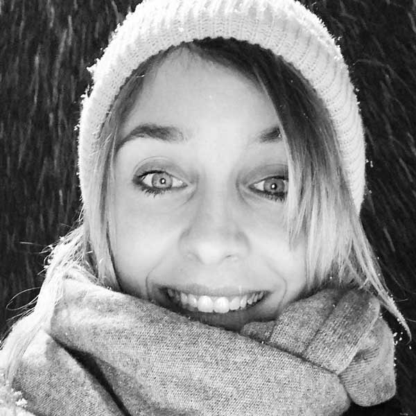 a girl in a hat and scarf.