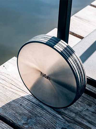 Illustrated is a metal object on a wooden dock, with the FIRE KITCHEN.