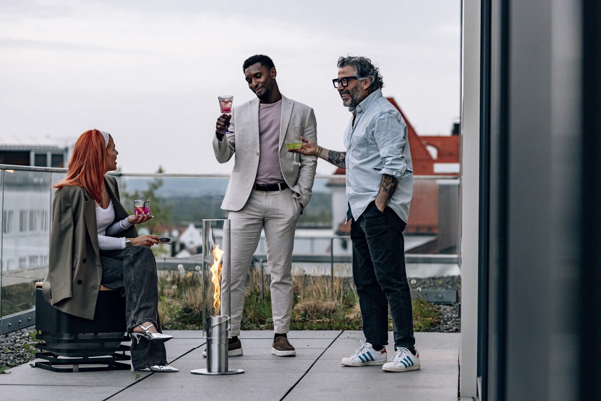 A man and woman standing on a roof the 00629 Spin 1500 elevation silver complements the moment with its thoughtful design.