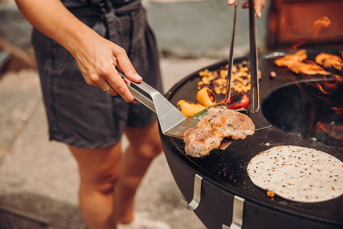 Spatula The 00473 Spatula is shown as a man is cooking food on a grill, creating a stylish and accessible visual.