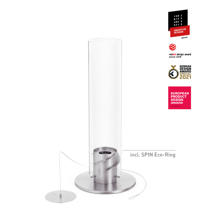 SPIN 1200 Tabletop Fireplace silver The photo presents a white metal cylinder with a silver base, with the SPIN 1200 Tabletop Fireplace silver.