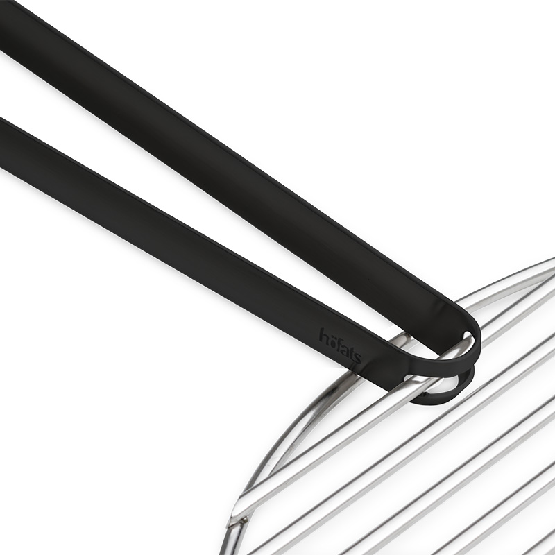 The 00859 barbecue tong is shown as a black metal tong attached to a steel grid, creating a stylish and accessible visual.