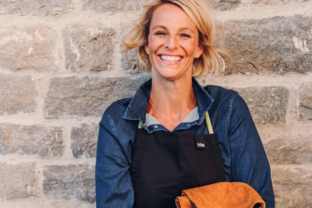 Apron The photo presents a woman in an apron and apron holding a bag