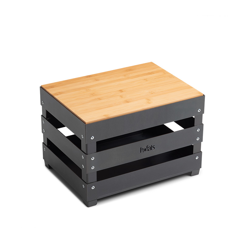 This image shows a black wooden box with a wooden lid, with the CRATE Board.