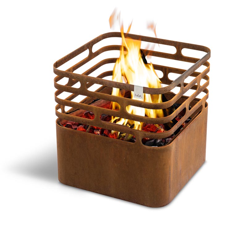 CUBE Fire Basket Corten Steel Scene showing a rusty metal cube with a handle, where the Cube Firebasket rusty stands out for its practical elegance.
