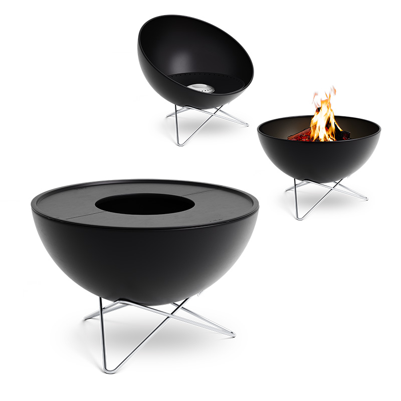 BOWL 70 Plancha BBQ Set low The photo presents a black fire pit with a flame in it, with the BOWL 70 Plancha BBQ Set low.