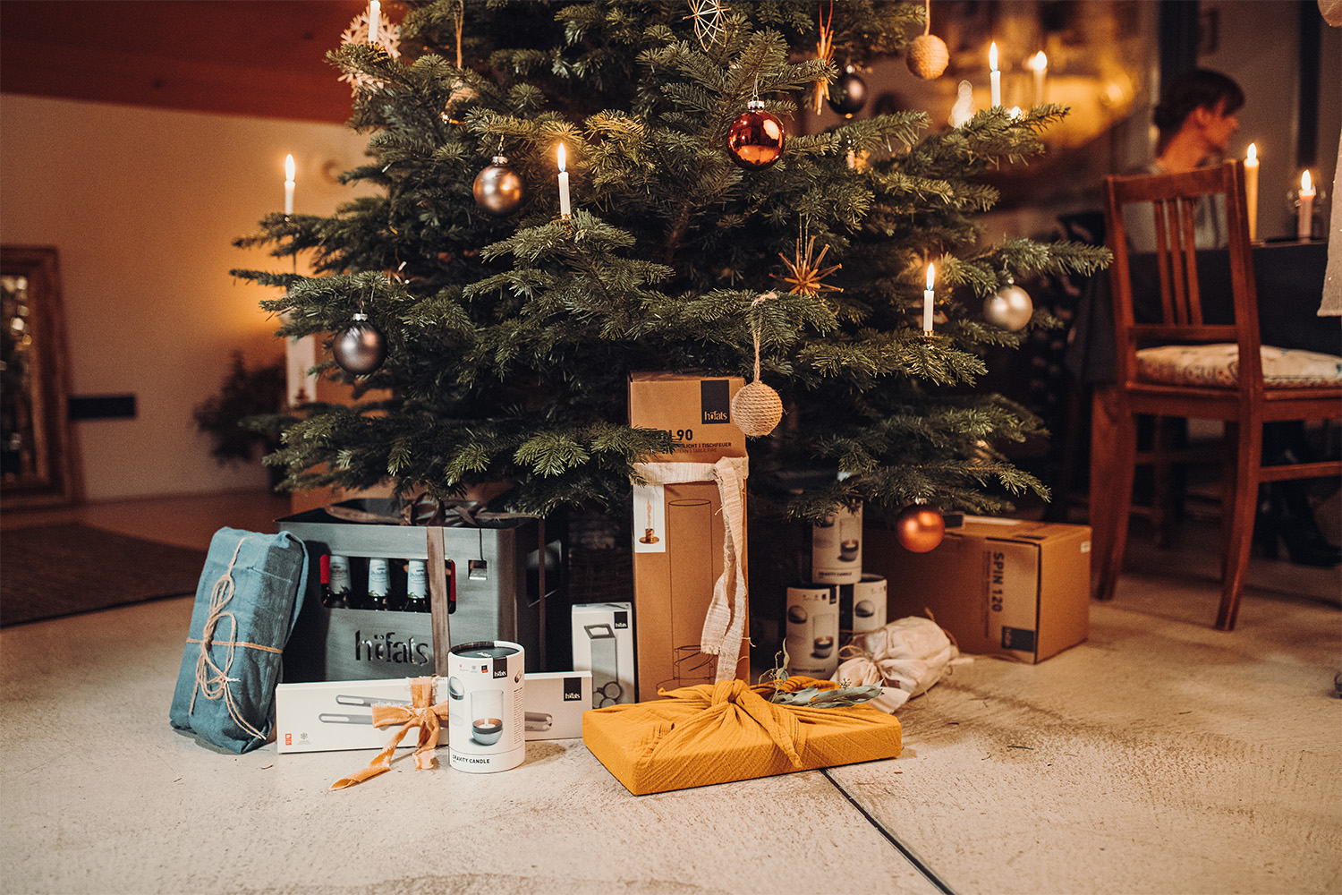 An image showing a christmas tree with a bunch of presents underneath, with the GIFT VOUCHER digital.