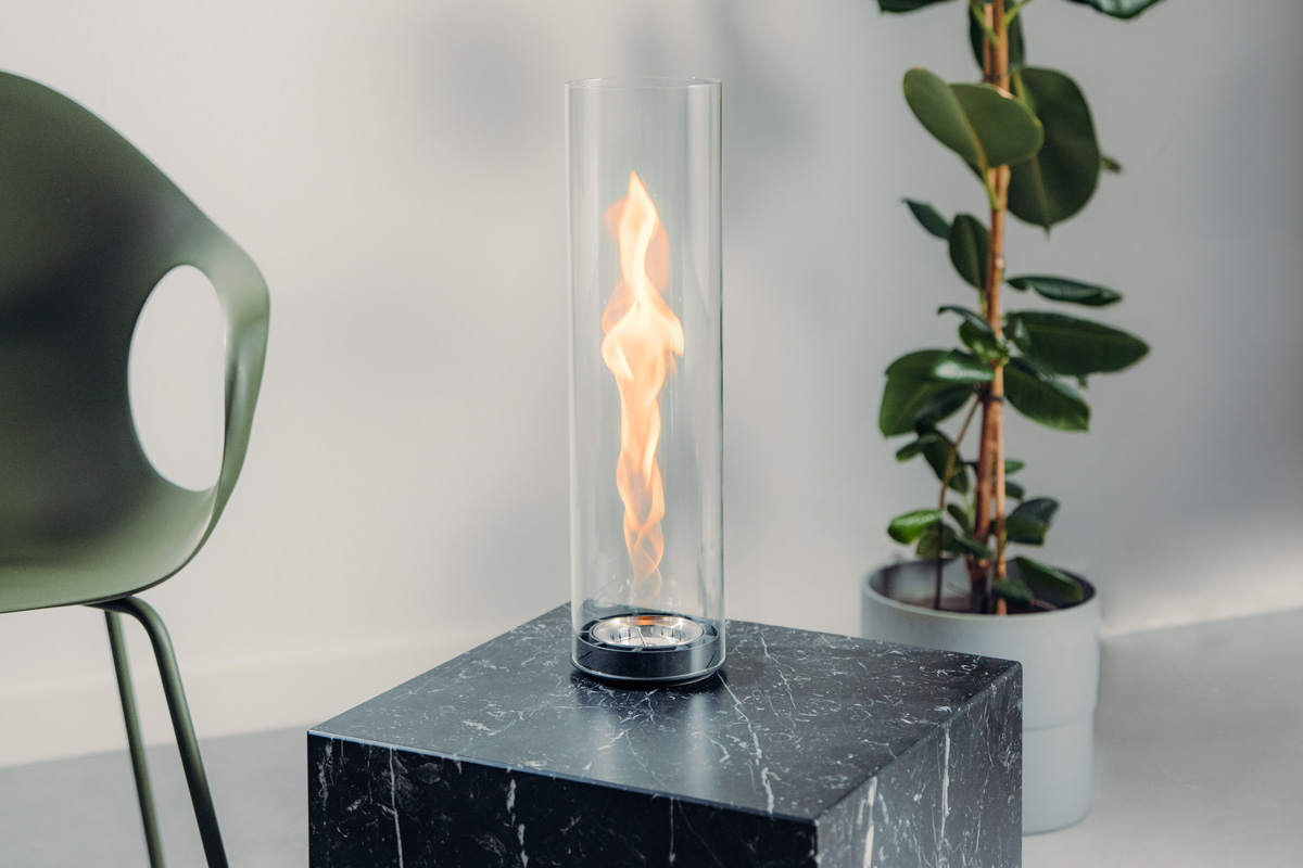 SPIN air 900 Built-in A black marble table with a glass cylinder on top, with the 00975 Spin Air 1200 built-in adding a functional and elegant touch to the scene.