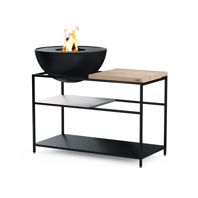 FIRE KITCHEN with BOWL 70 Plancha BBQ Set low Illustrated is a black fire bowl on a stand, with the FIRE KITCHEN with BOWL 70 Plancha BBQ Set incl. wheels.