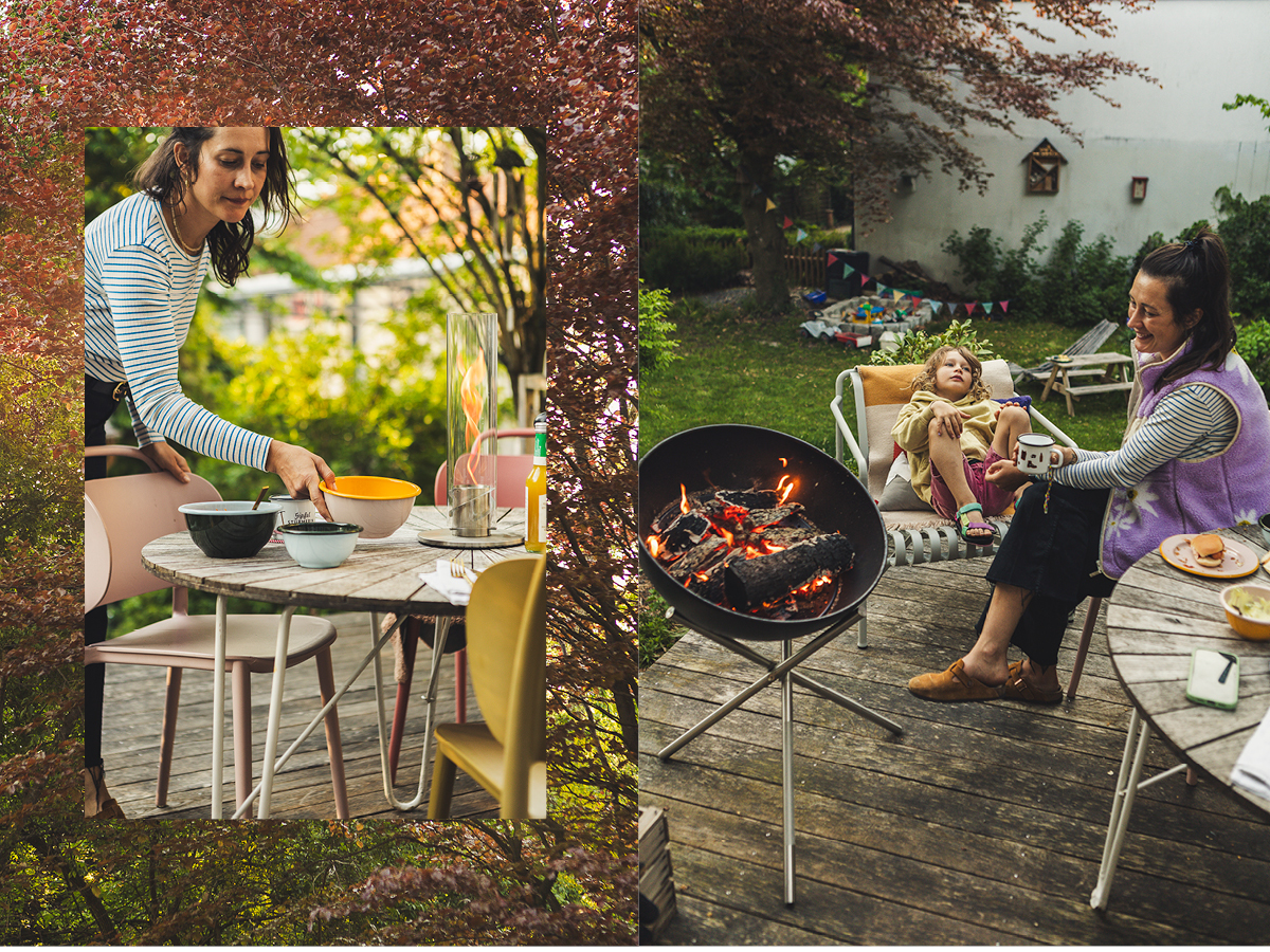 a woman sitting at a table with a kid next to a fireplace