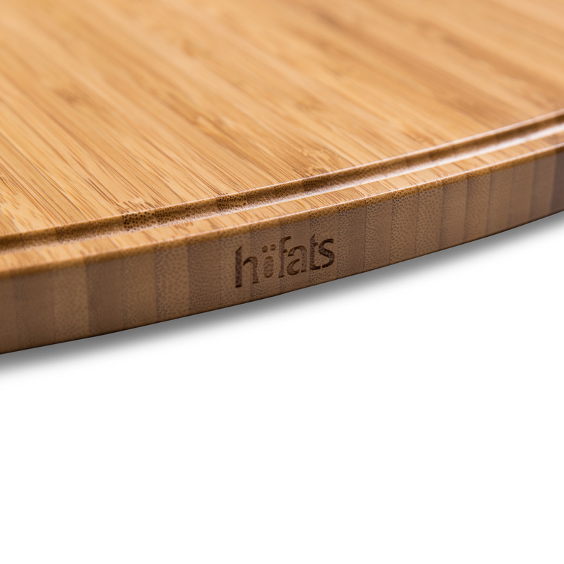 CONE Board Illustrated is a cutting board with a wooden handle, with the CONE Board.