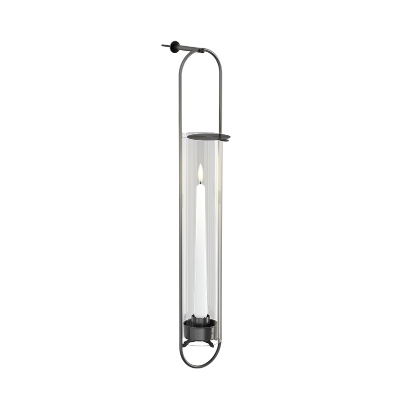 A depiction of a black wall light with a glass shade, featuring the 00285 OVAL CANDLE Wall Mount black as a central and purposeful element.