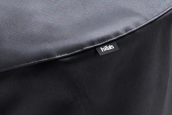 CONE Cover An image showing the back of a black backpack with a zippered pocket, with the CONE Cover.