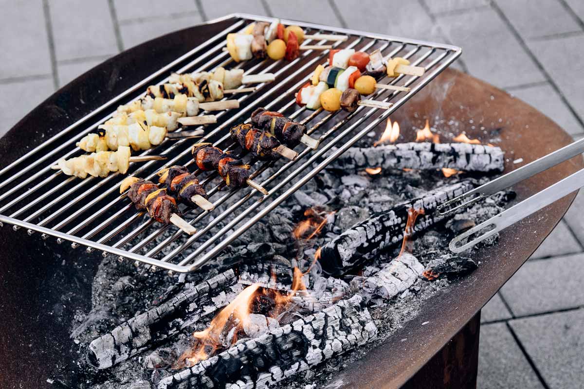 A view of a grill with food on it, with the ELLIPSE Grid.
