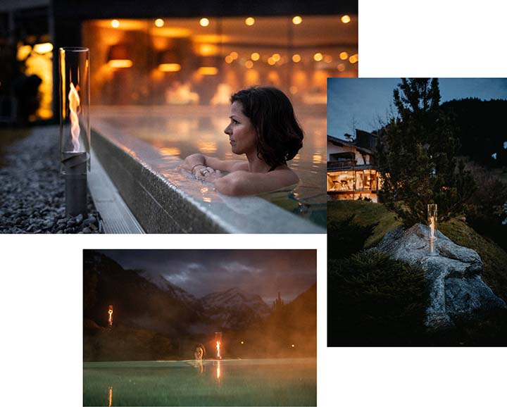A view of a woman in a hot tub at night