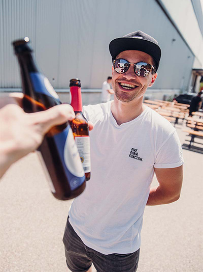 a man holding a beer bottle.