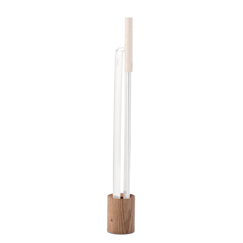 Illustrated is a white and wood floor lamp with a wooden base, with the Wooden Base for Blow Poker and Fire Tongs.