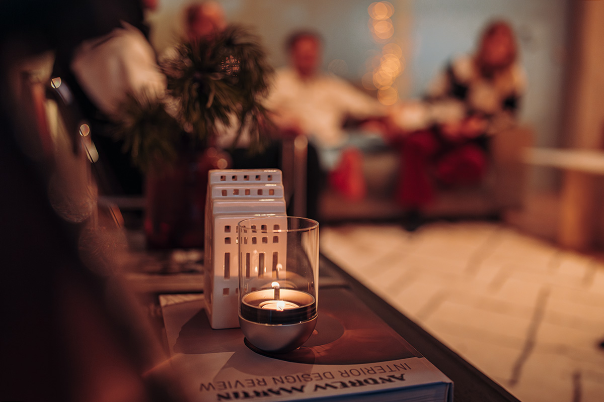 two christmas presents on a table with the refined touch of the Gravity Candle