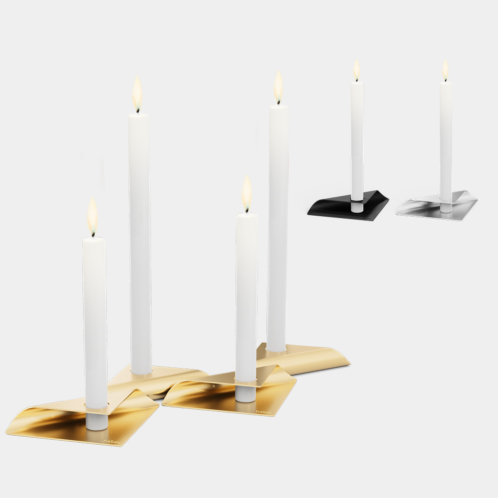 Three white candles with gold and silver bases, showing examples of product customisation with square candle