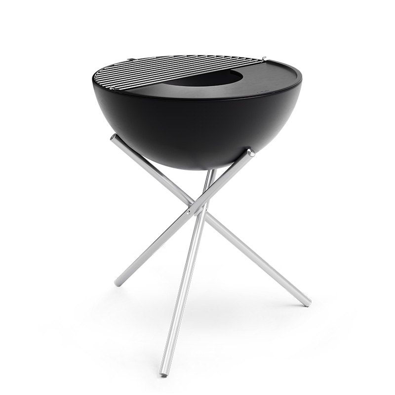 A view of a barbecue grill with a black grill top, with the BOWL 70 Grid.