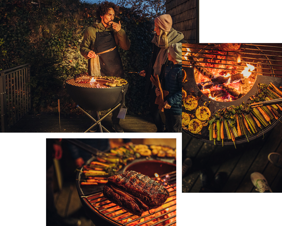 The photo presents a couple cooking food on a grill, with the BOWL Fire Bowl.