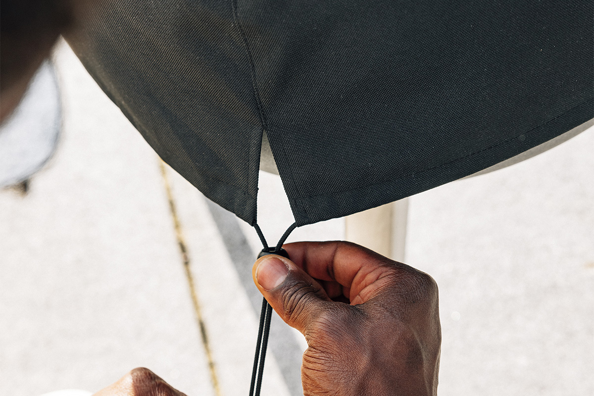 A person closing the cover over a moon 45, with the 00815 Moon 45 Cover adding a functional and elegant touch to the scene.