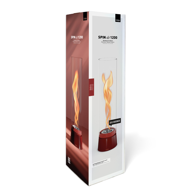 SPIN air 1200 Tabletop Fireplace enamel red An inviting scene highlights the Spin Air 1200 Tablefire Emaille red Packaging, blending effortlessly into its surroundings.