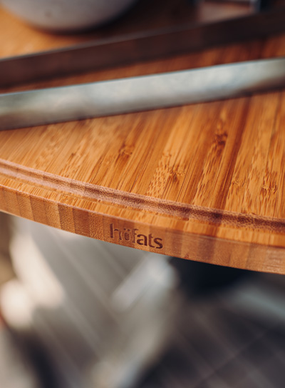 An image showing a knife on a cutting board, with the CONE Board.
